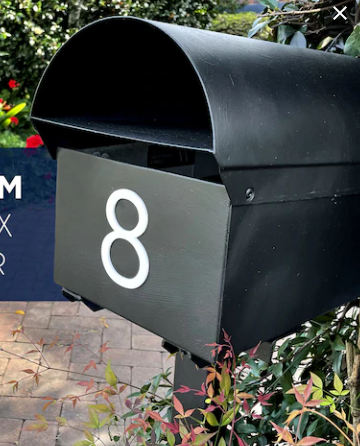 Black letterbox with a white number 8 applied to the side